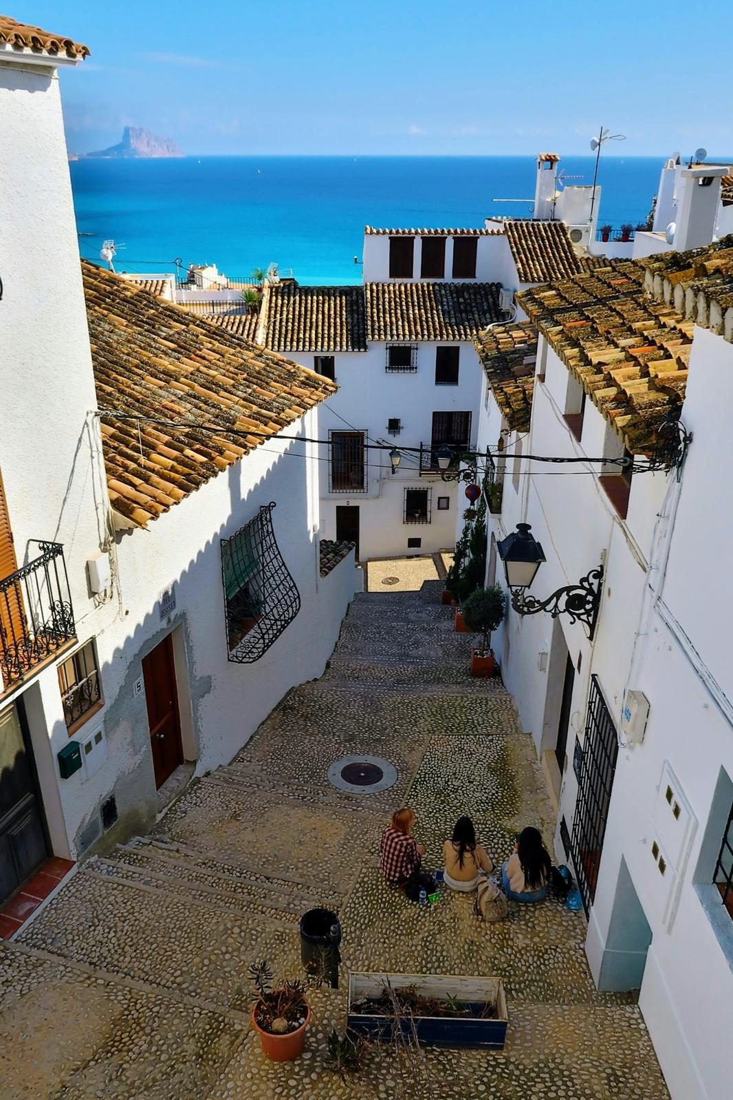 A whitewashed Costa Blanca old-town courtyard where the community gathers
